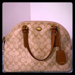 Coach leather shell bag with signature canvas.